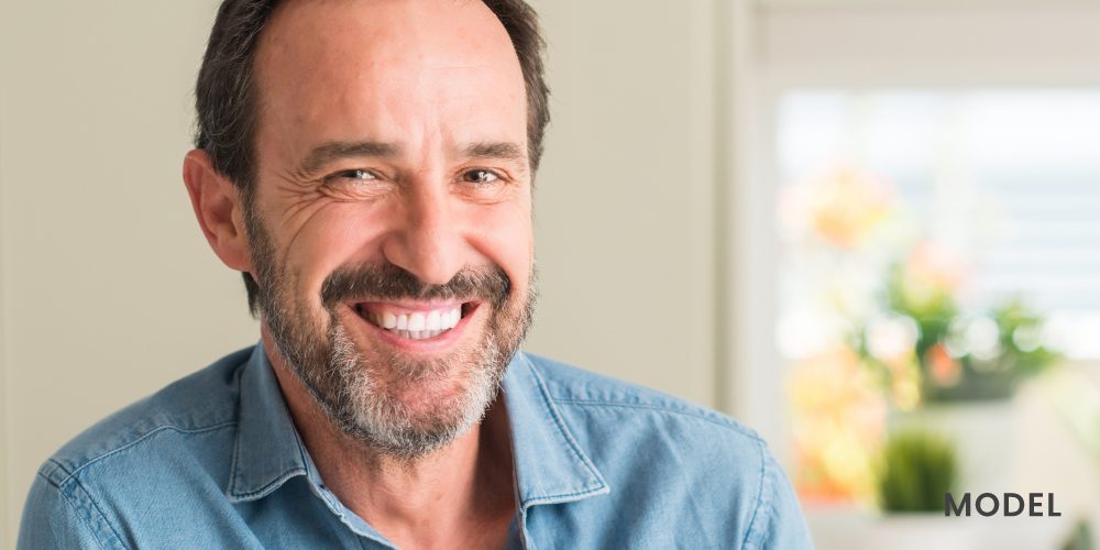 Older Man Smiling After Gum Disease Treatment